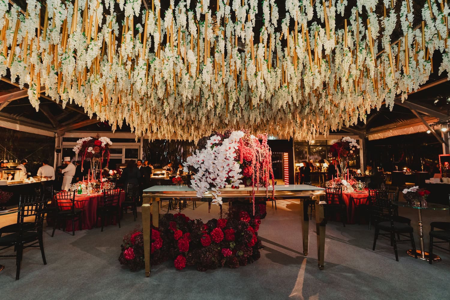 Statement Floral Display Under Wisteria Ceiling