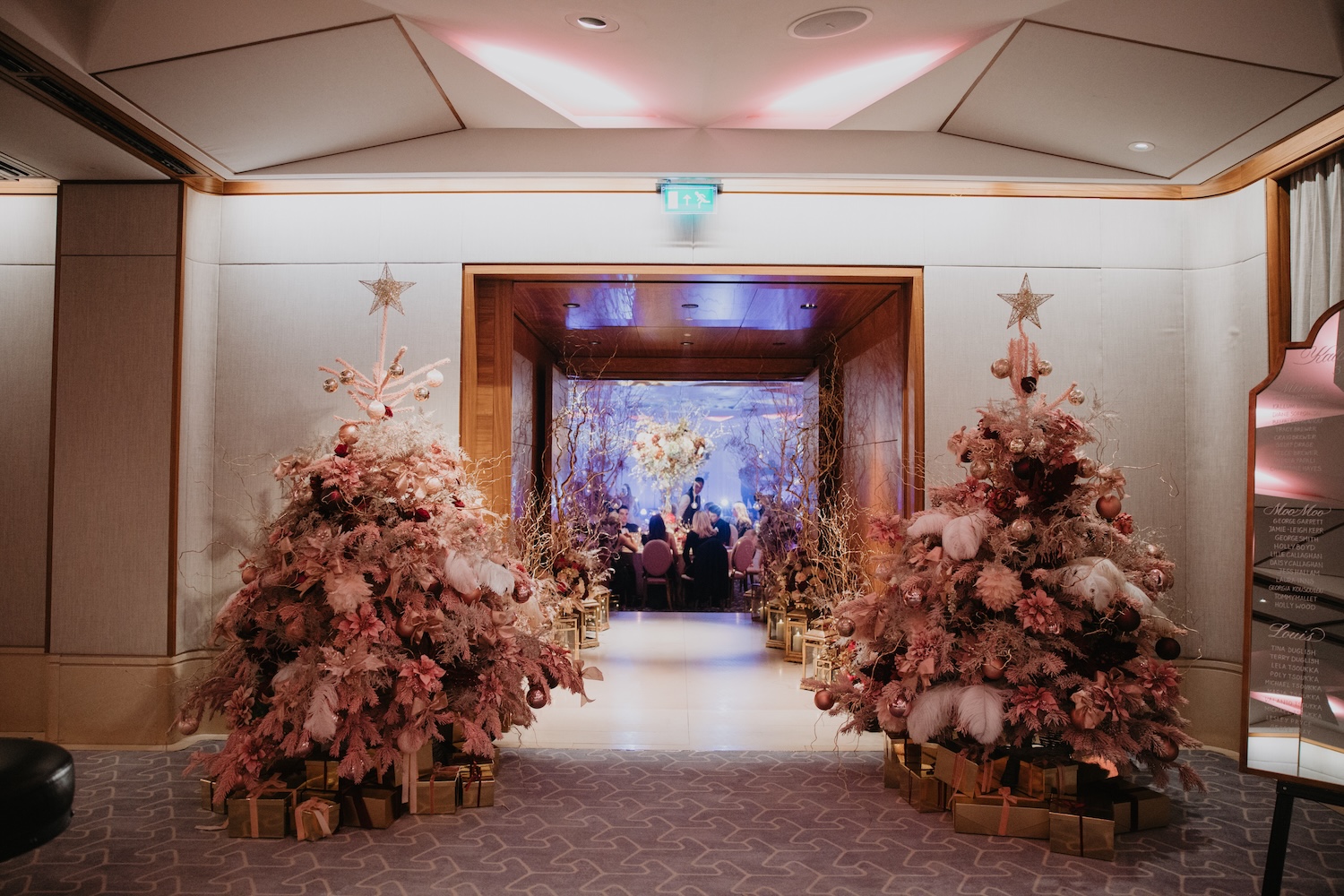 Pink Christmas Trees Framing Wedding Reception Entrance